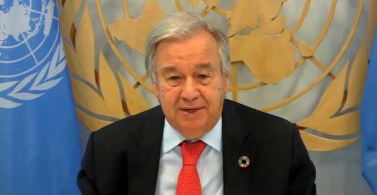 United Nations Secretary General seated at desk as he address Women's Civil Society Audience